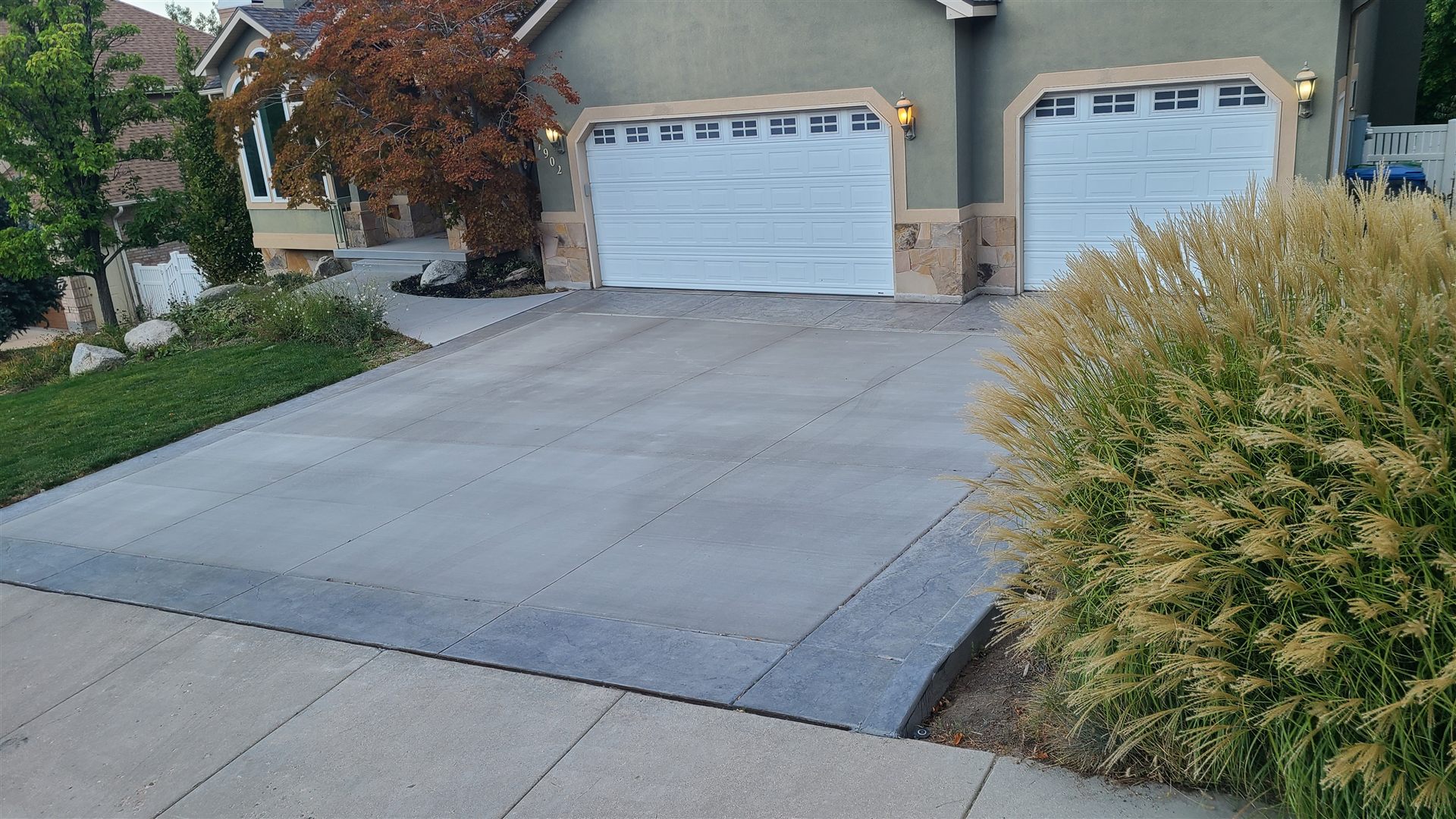Broom-finish concrete driveway with stamped border, Wasatch Front, Utah