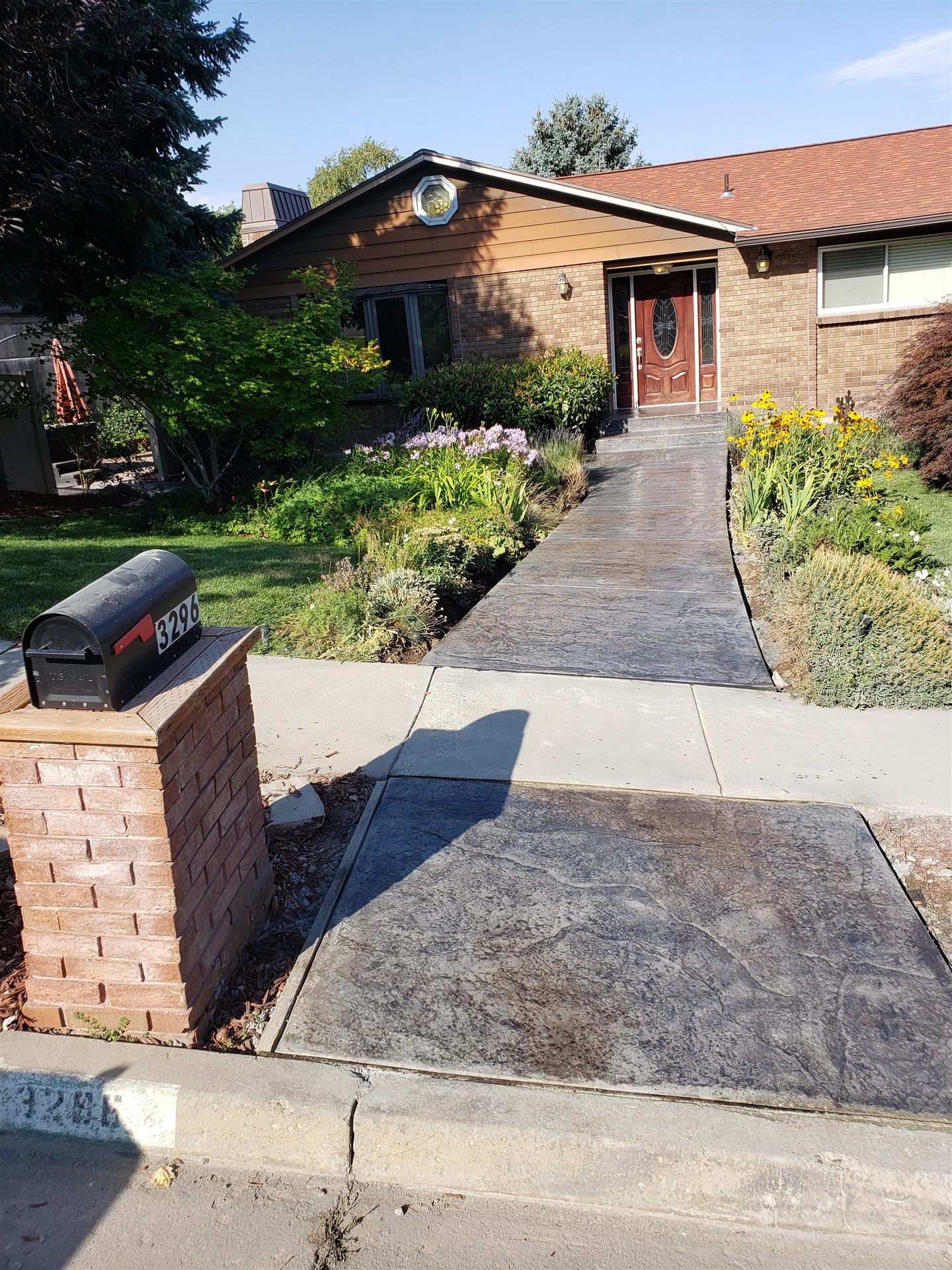 Stamped concrete walkway to a Wasatch Front, Utah home entry